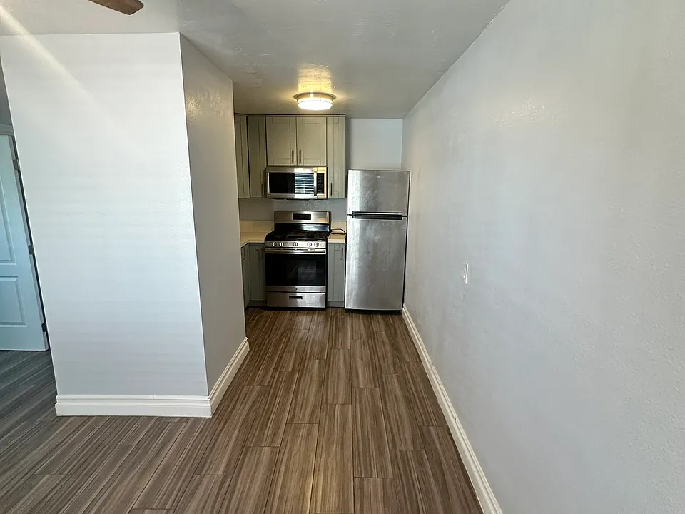 From front door in living room to the kitchen