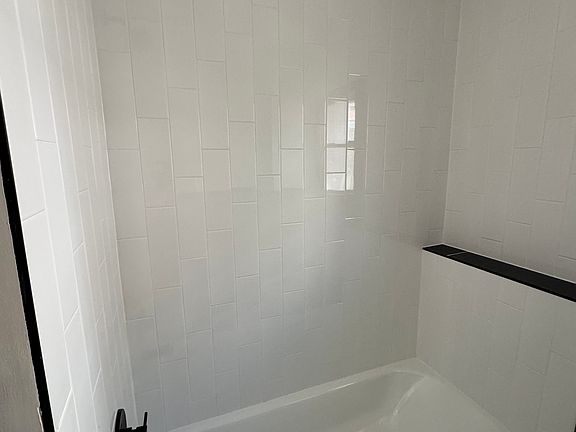 Gorgeous subway tile and new fixtures complete this bathroom upgrade