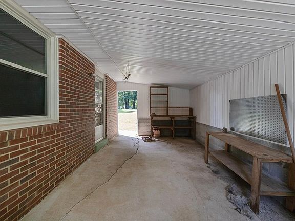 Nice storage area adjacent to the house.