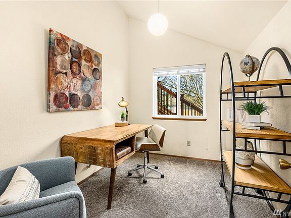 Separate office space with vaulted ceiling.