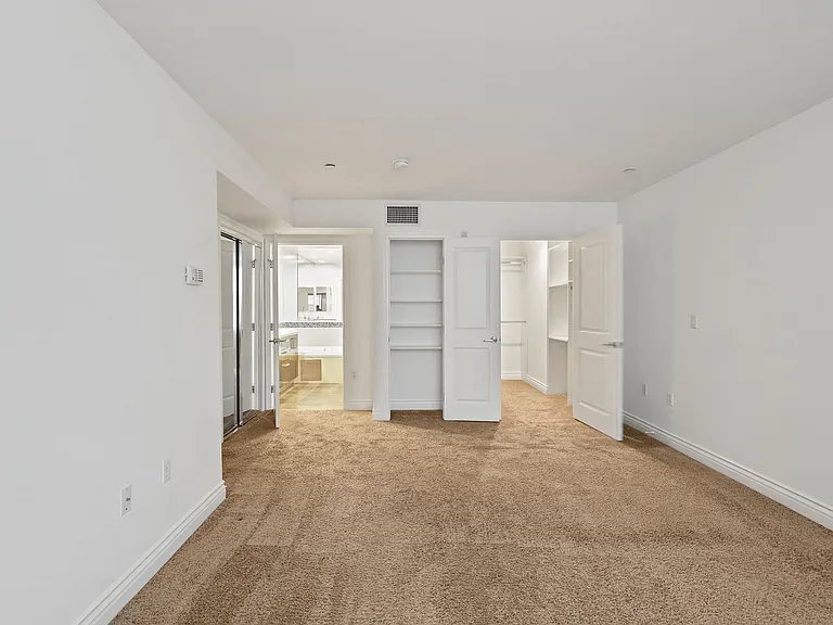 Bedroom with Bathroom, Closet with Shelving, and Large-Size Mirrored Closet
