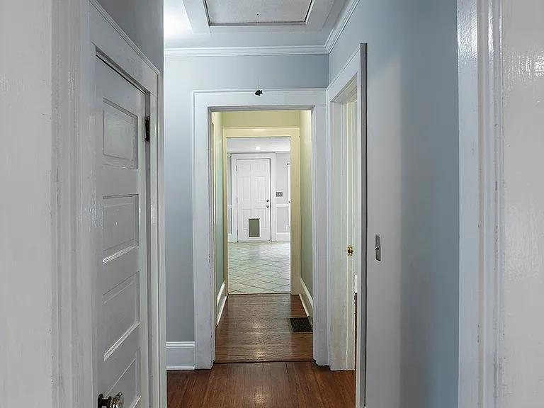 Coat closet, linen closet and attic storage above - bedroom 2 and 3 are off of this hallway leading to master bath, kitchen, dining room, laundry room/pantry and out to the huge backyard.