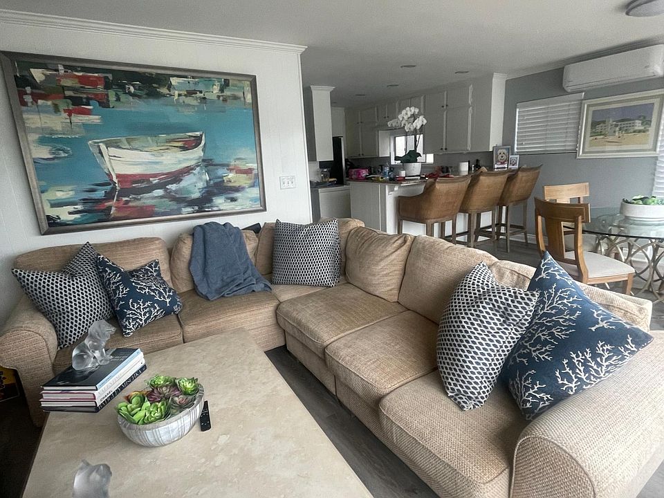 Great room - all overlooking the water - fireplace and Big screen above the fireplace