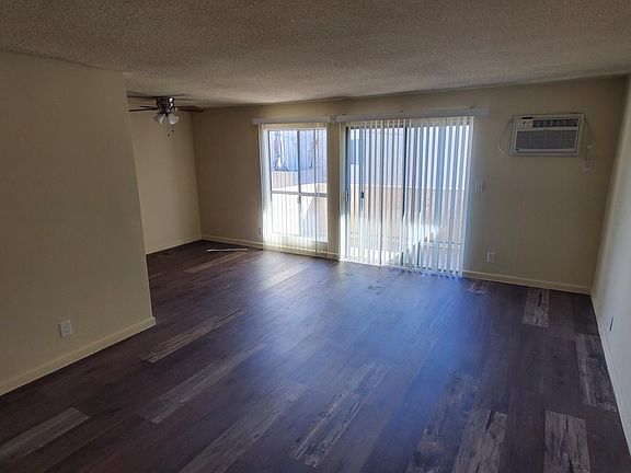 Living room/dining area/balcony from entryway