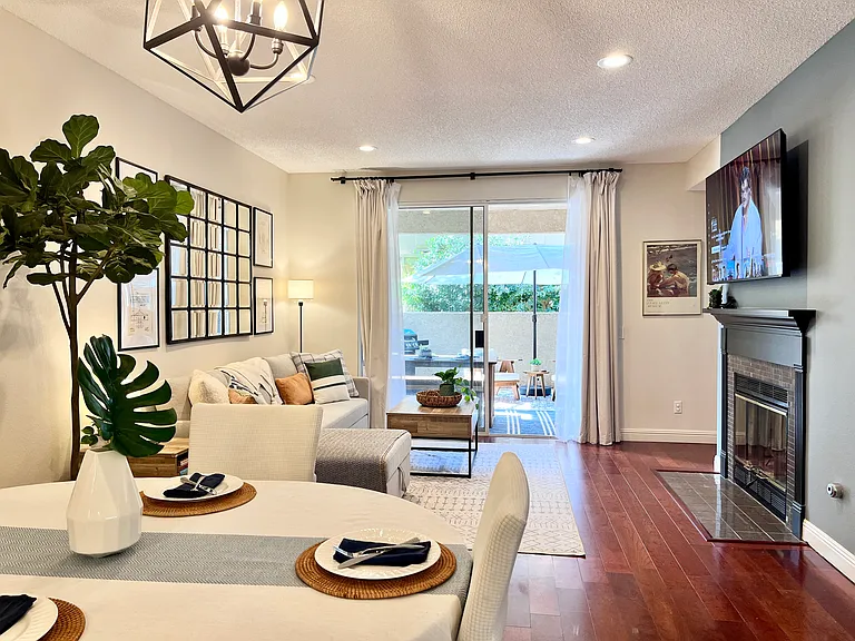 Living and dining room with gorgeous natural light, quiet privacy, and greenbelt views.