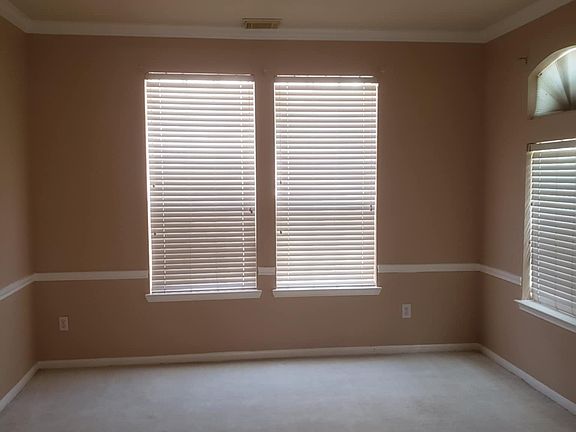 Room 1 - Located in the first floor with multiple windows & crown modlings