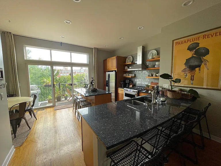 View of kitchen and deck from living room