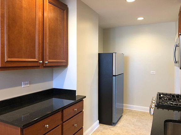 Eat-in kitchen with stainless steel appliances