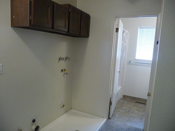 laundry area, looking into bathroom