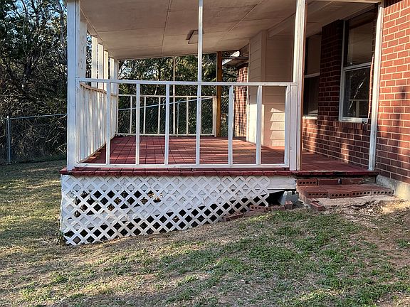 Smell that bar b que cooking on the pit with family and entertainment on this large back porch