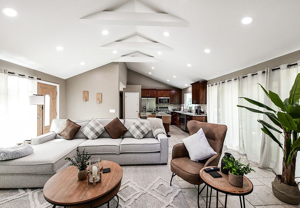 Open, airy Kitchen, Dining Room, Volume Ceiling!
Family Room with Doors opening to Patio overlooking half acre!