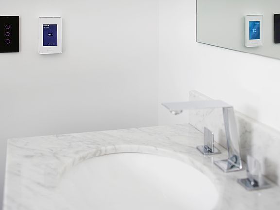 The renovated bathroom features radiant floor heating for added comfort.