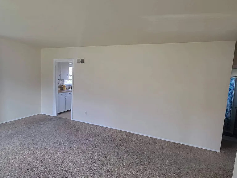Living room - entry to kitchen on left