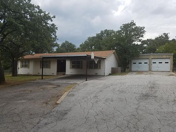 Has detached garage and lots of parking
