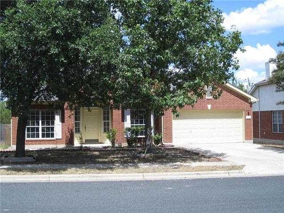 Front entrance, front yard with large trees. Brand new AC.