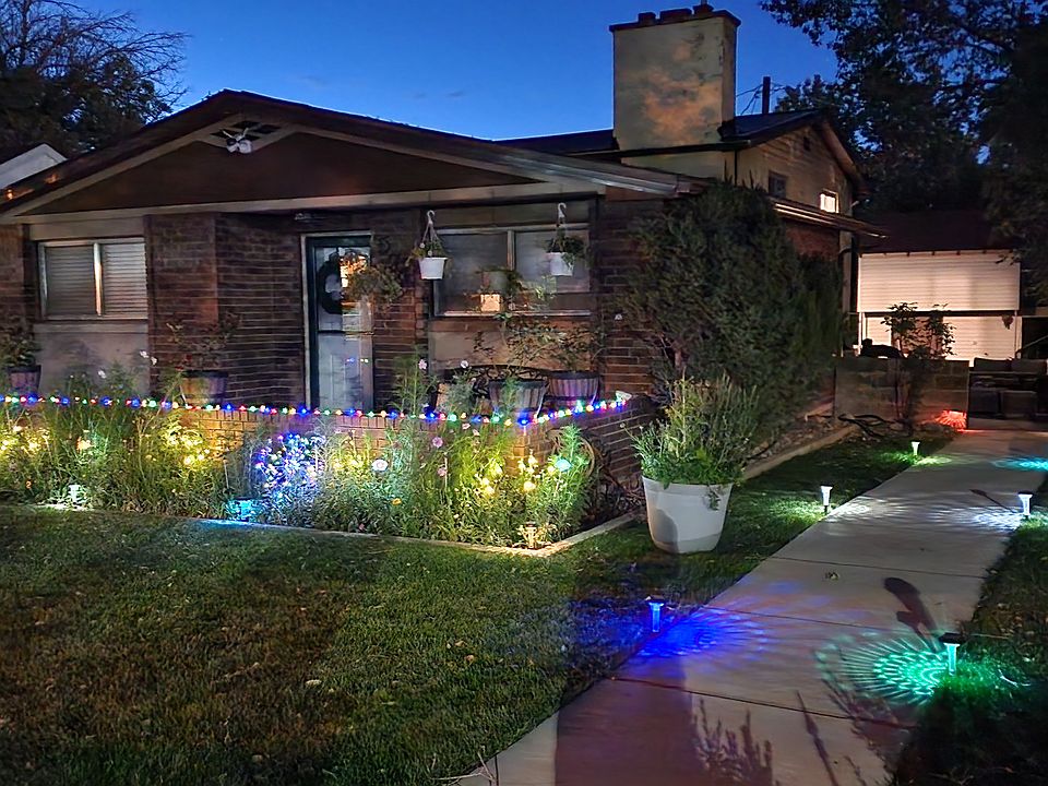 Front of the house with added colorful solar lights.