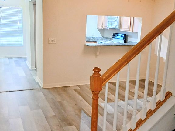 Dining area with hall entrance and view into the kitchen/stairway