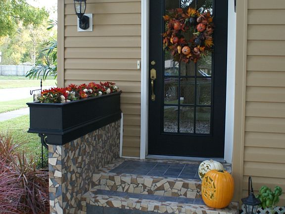 Charming entry with tiled steps & new flower box