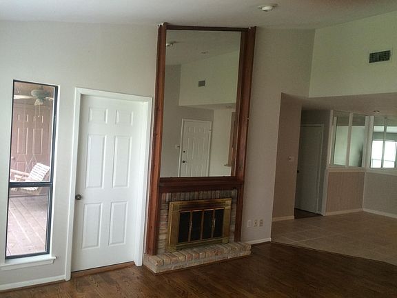 Family Rm: Balcony access; Hardwood floor, wood burning FP