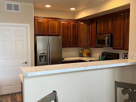 Kitchen with laundry behind closed door