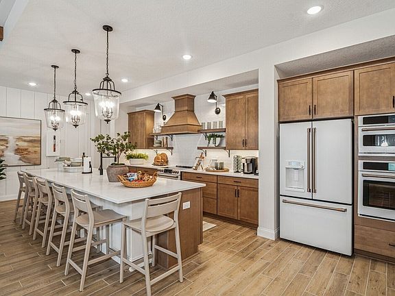 Kitchen with warm-toned cabinetry