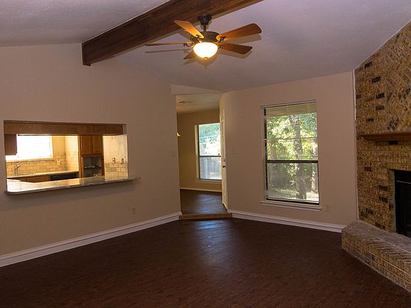 Living area looking into the kitchen and dining area