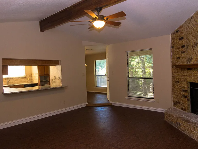 Living area looking into the kitchen and dining area