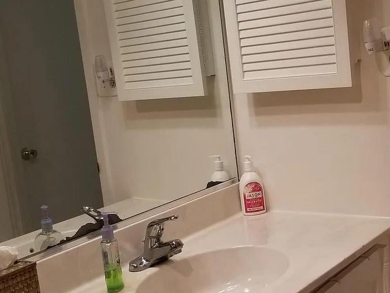 Spacious vanity with good counter space and extra storage space below and above!
