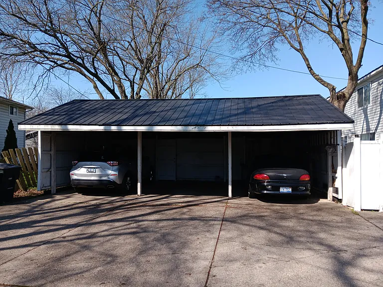 Car port with backdoor access to your unit for first Car