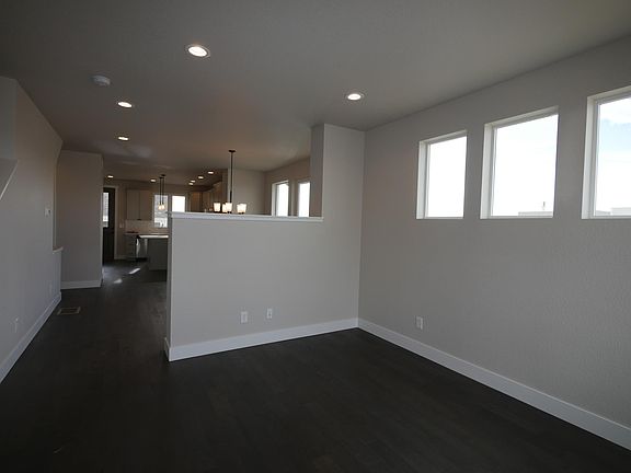 Great room with dividing wall to dining area