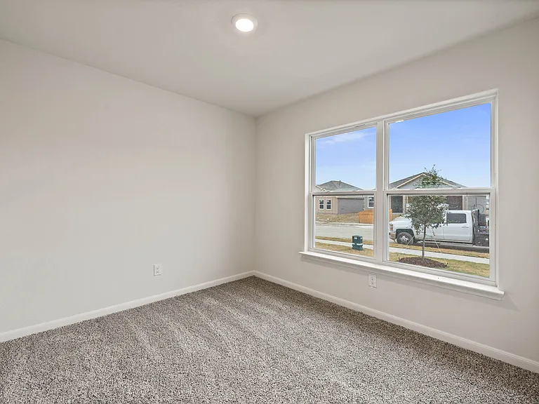 The secondary bedroom is a perfect space for children's bedrooms or guest rooms.