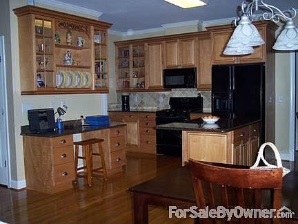 Kitchen with built in desk, large island