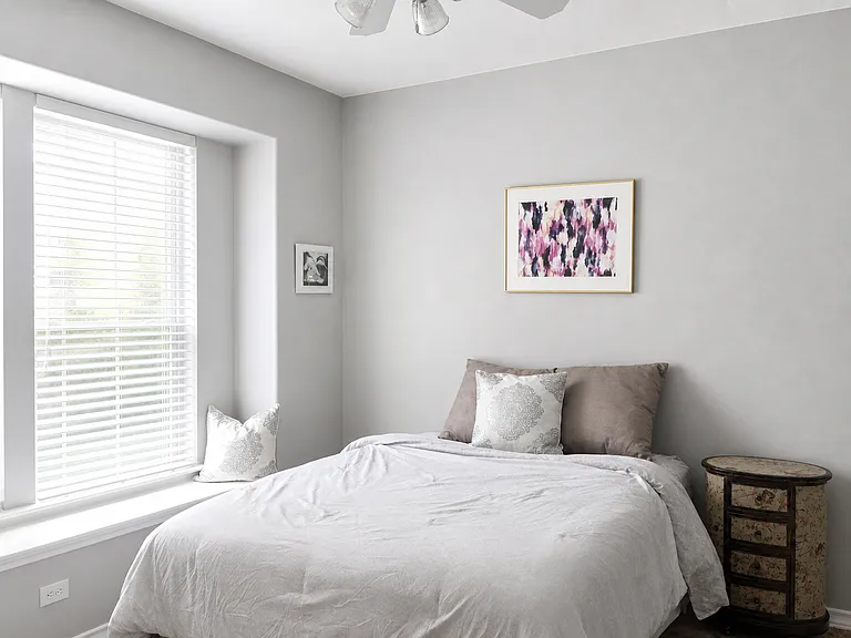 Primary Bedroom with big windows.