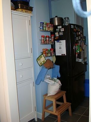 Left side of Kitchen. Refrigerator is a bottom freezer model