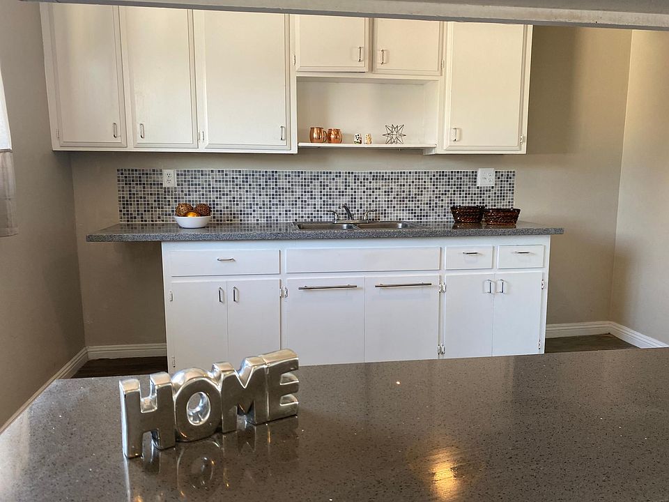 Kitchen Granite countertops and mosaic back splash