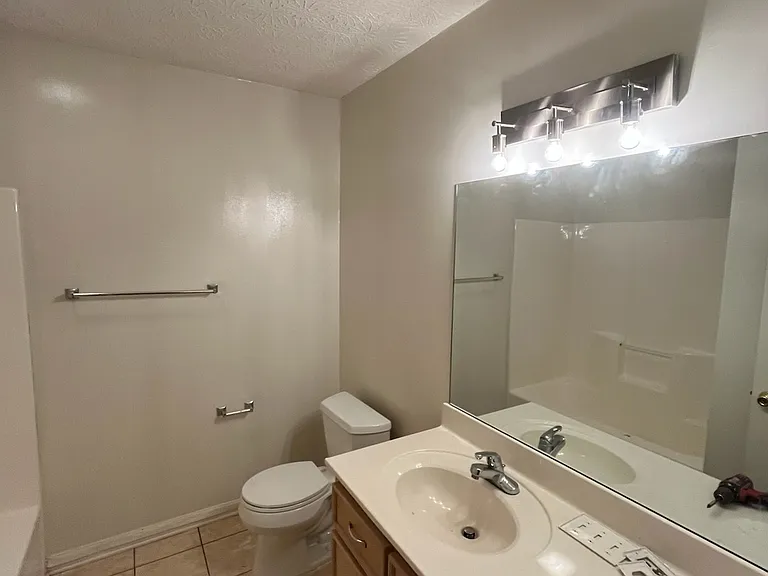 Main Bathroom, fresh paint and new lighting fixture.