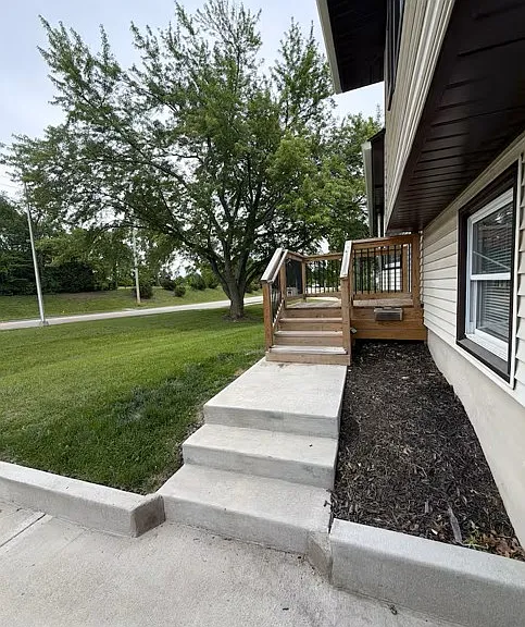 Private front entrance with mature shade trees