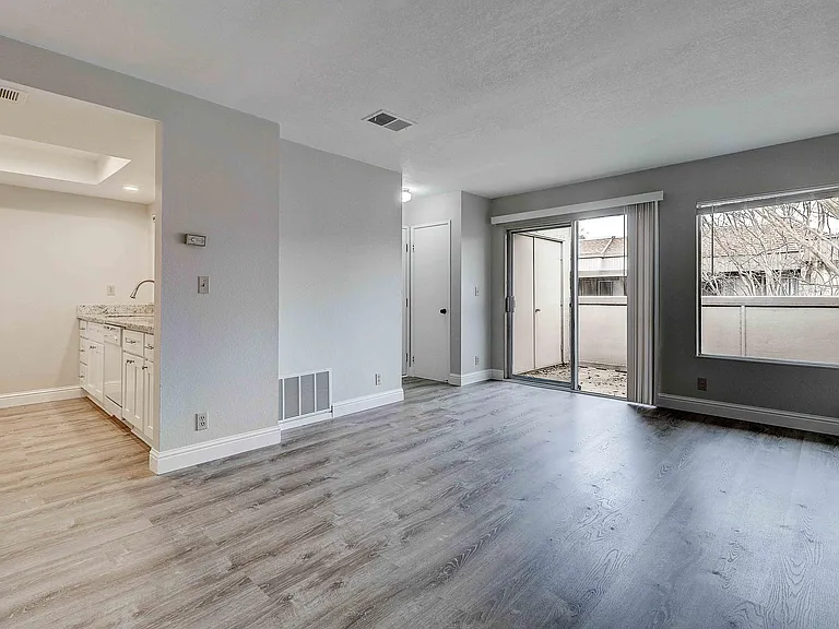 Living Room/Dining/Kitchen view to balcony