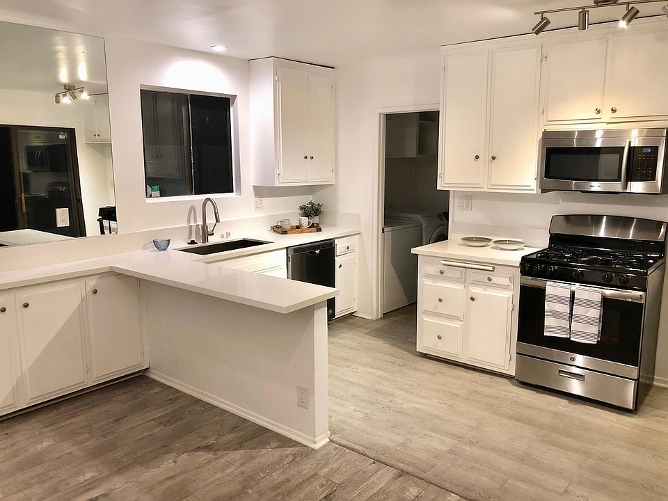 Eat-In Kitchen, White Quartz Counters and Stainless Steel appliances