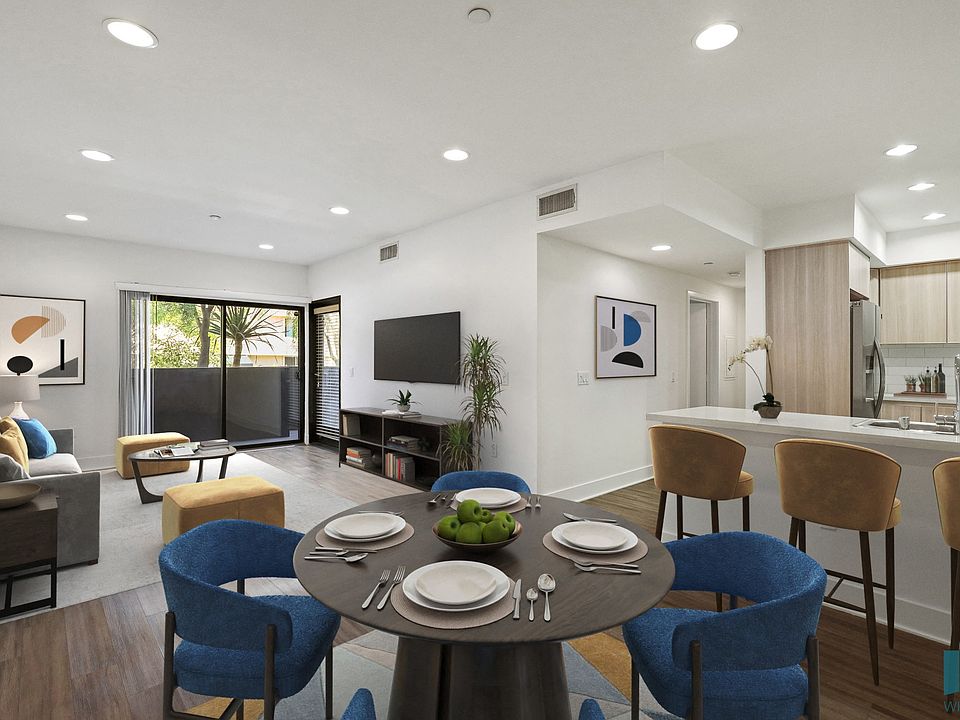 Open-Concept Kitchen, Living, and Dining Room with Patio