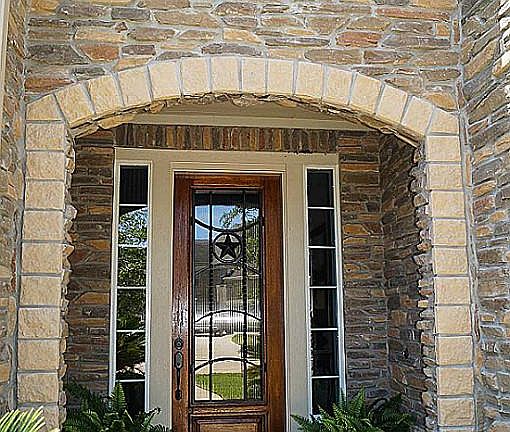 Beautiful front door & landscaping offers a beautiful first impression