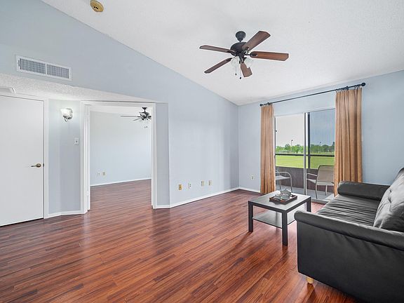 Freshly paint throughout. Ceiling fans in all rooms. Here is the living area. Bedroom is the one with the double doors open.