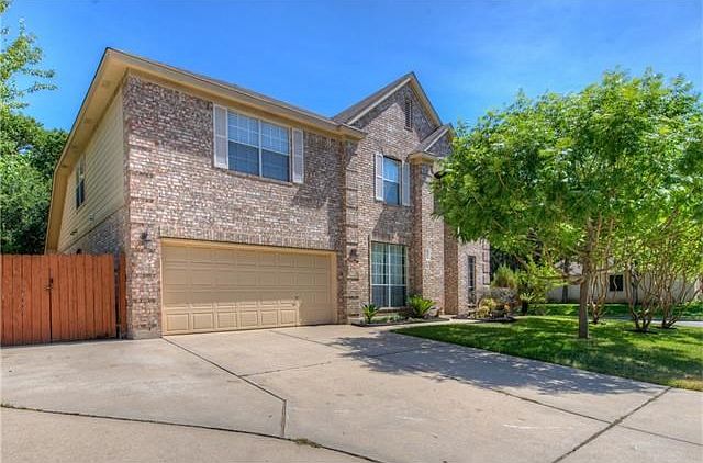 Beautiful curb appeal on this lovely home and it features additional RV parking with gated access!