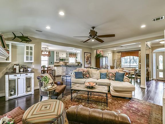 The Beautiful Wood Floors & Natural Light Flow Through The Home s Open, Airy Layout.