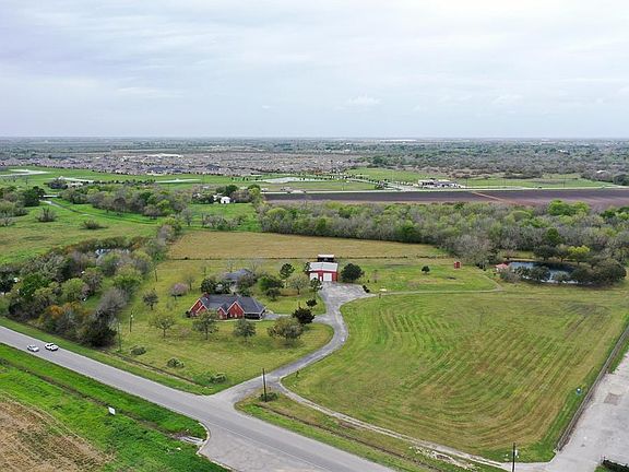The large Pool behind the home is free-flowing with a Slide and already includes a Safety Fence.