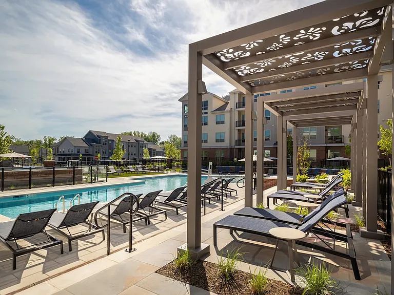 Resort-style pool with poolside lounge and cabanas