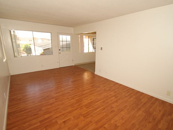 Living room w large window allows plenty of light
