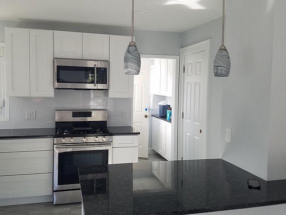 Kitchen and pantry area to back deck.