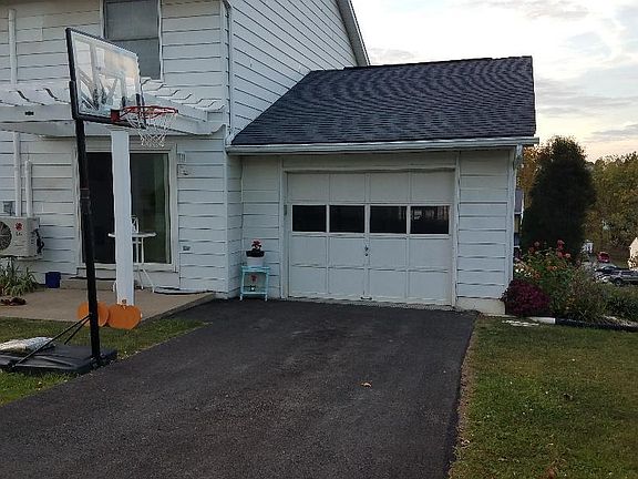1 car garage with openers and keyless entry. Garage has nice extra space for storage and shelves