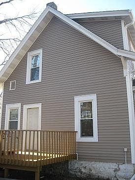 Back of house with deck